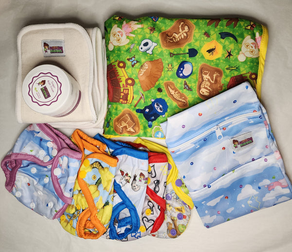 fandom inspired designs in newborn cloth diaper bundle including inse4rts, changing pad, wetbag, and diaper cream.