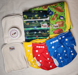 red, yellow, and blue pocket cloth diaper bundle including inserts, changing pad, wetbag, and diaper cream.