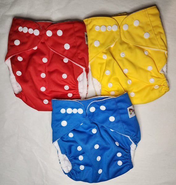 red, yellow, and blue pocket cloth diaper bundle