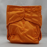 overnight cloth diaper. A modern cloth diaper with a fandom-inspired design. Vibrant and detailed, color inspired by legend of zelda. Ganon Orange