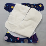 Overnight cloth diaper. inner view of two semi attached bamboo cotton inserts